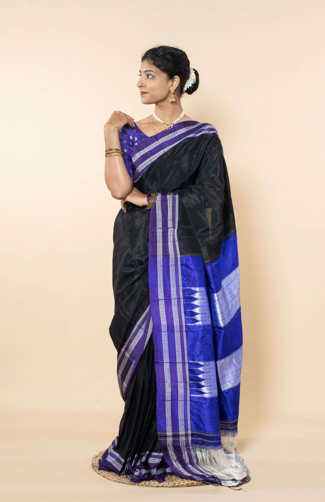 Lustrous Ocean Blue Silk Saree Adorned With Elegant White Accents